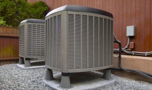 two air conditioning units outside a house