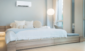 a bedroom with a ductless mini split